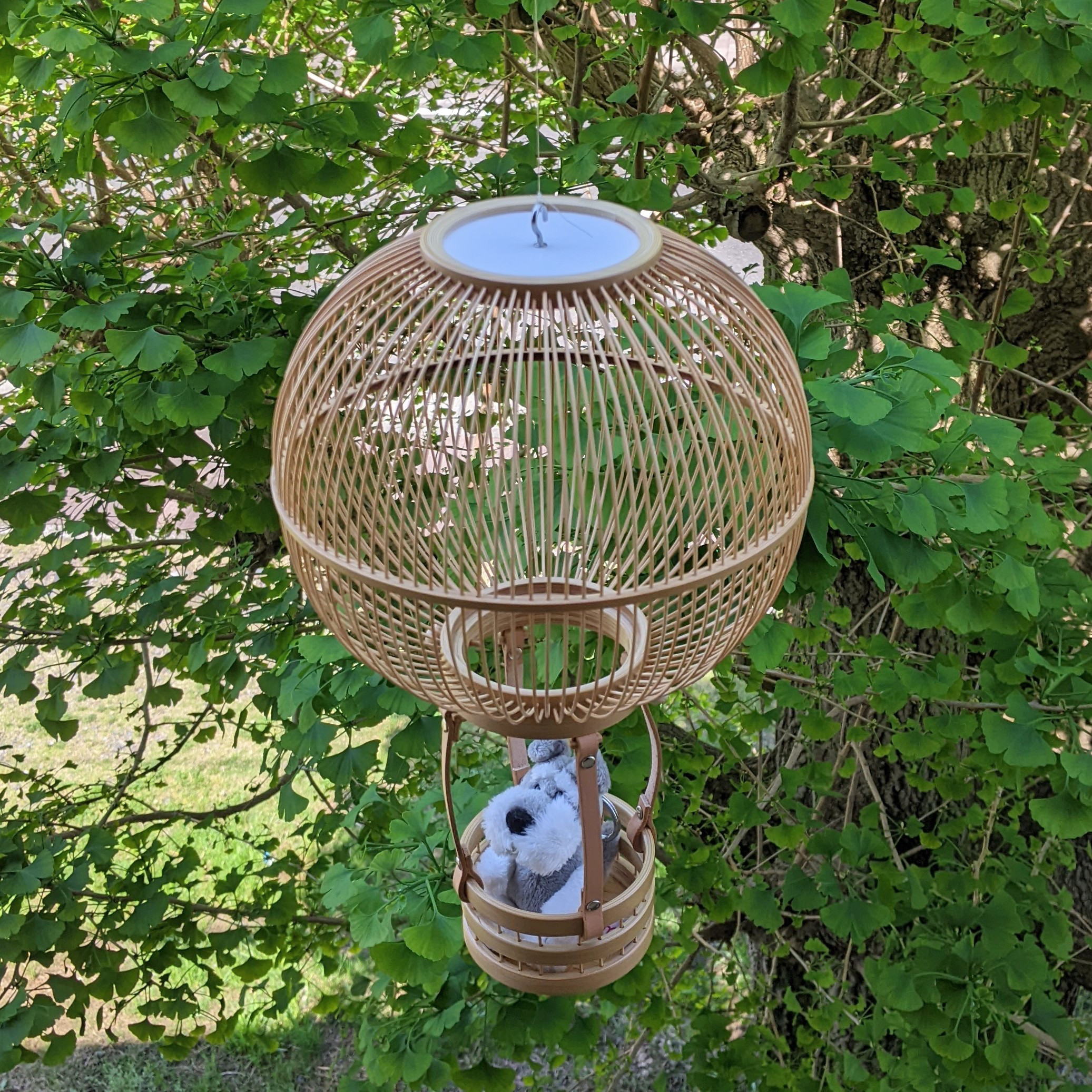 Handcrafted Suruga bamboo hot air balloon hanging ornament with leather accents and a small removable basket.