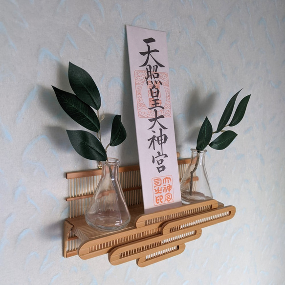 Compact modern wall-mounted Kamidana made of delicate vertical bamboo sticks and a cedar base, featuring a carved bamboo cloud motif. – view 2