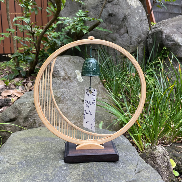 A delicate tabletop wind chime featuring a crescent moon-shaped Suruga bamboo frame holding a small dark Nambu cast iron bell – view 2