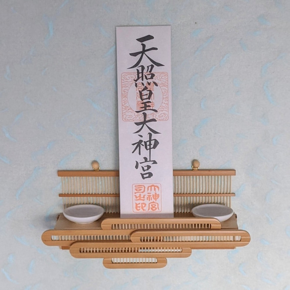 Compact modern wall-mounted Kamidana made of delicate vertical bamboo sticks and a cedar base, featuring a carved bamboo cloud motif. – view 3