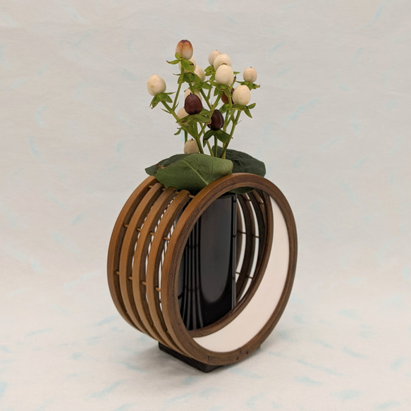 A crescent moon-shaped bamboo flower vase featuring a blend of traditional woven bamboo splints and modern white leather detailing. – view 3