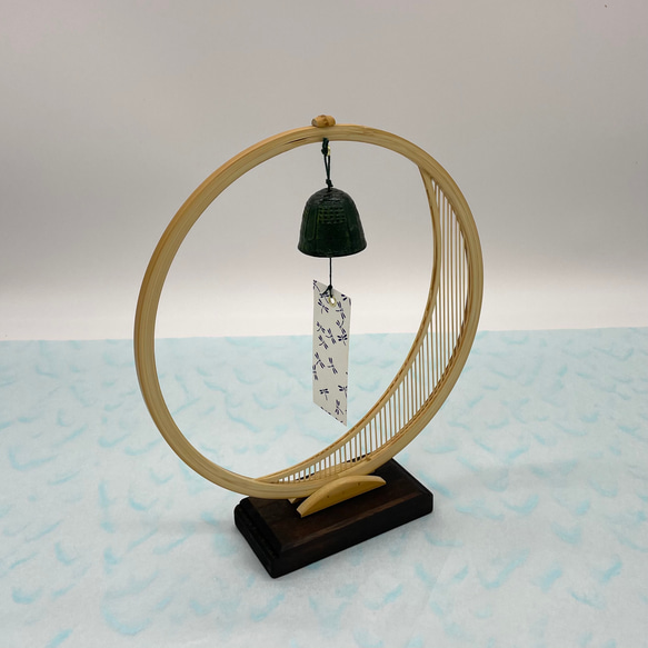 A delicate tabletop wind chime featuring a crescent moon-shaped Suruga bamboo frame holding a small dark Nambu cast iron bell – view 3