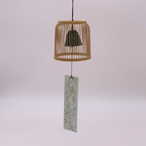 A delicately woven Suruga bamboo wind chime dome inspired by a Komuso monk's basket hat, containing a black Nambu iron bell. – view 3