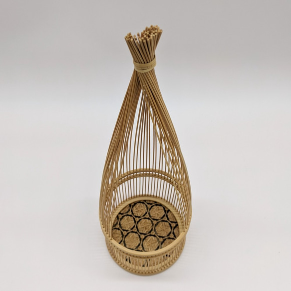 Handmade Suruga bamboo flower vase shaped like bundled straw, standing elegantly with its detailed patterns on its woven base – view 2