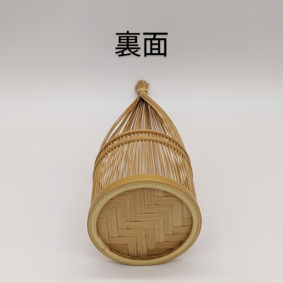 Handmade Suruga bamboo flower vase shaped like bundled straw, standing elegantly with its detailed patterns on its woven base – view 4
