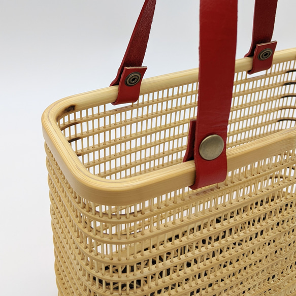 A rectangular hand-woven Suruga bamboo basket bag with a red leather handle and a vintage white silk drawstring inner pouch featuring a mist pattern – view 5