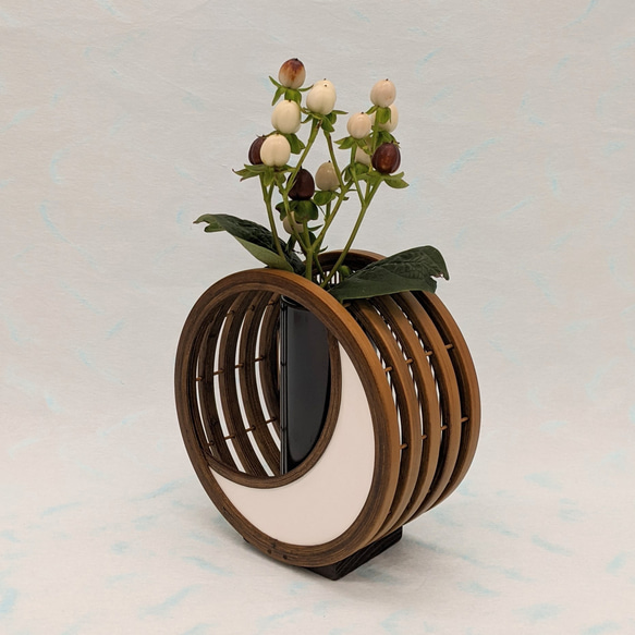 A crescent moon-shaped bamboo flower vase featuring a blend of traditional woven bamboo splints and modern white leather detailing. – view 2