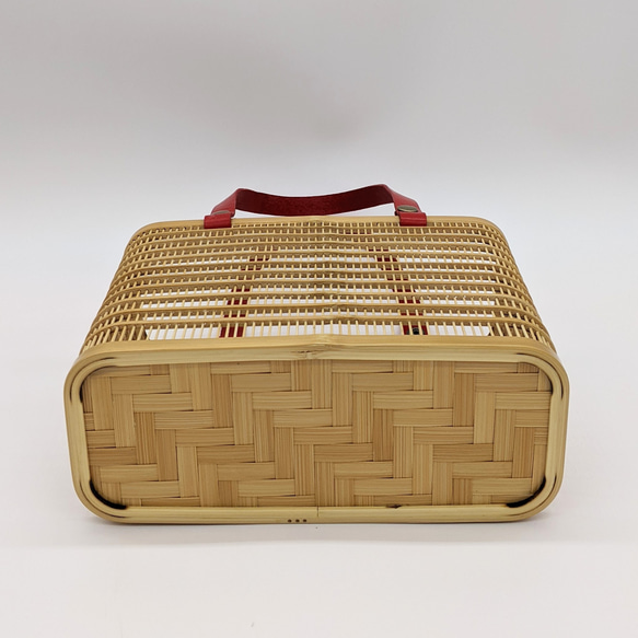 A rectangular hand-woven Suruga bamboo basket bag with a red leather handle and a vintage white silk drawstring inner pouch featuring a mist pattern – view 6