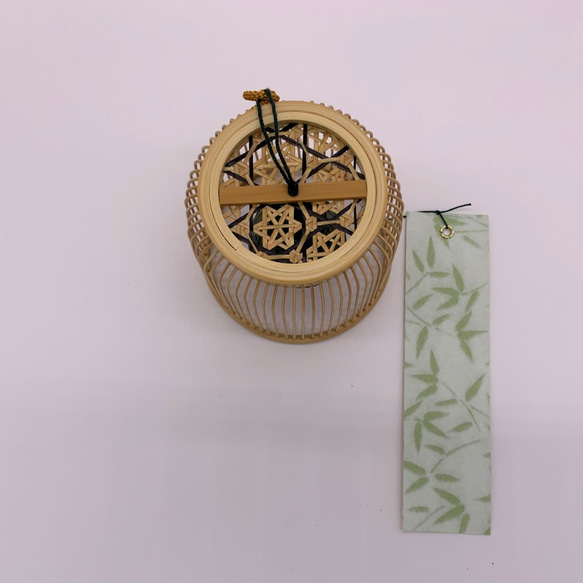 A delicately woven Suruga bamboo wind chime dome inspired by a Komuso monk's basket hat, containing a black Nambu iron bell. – view 5