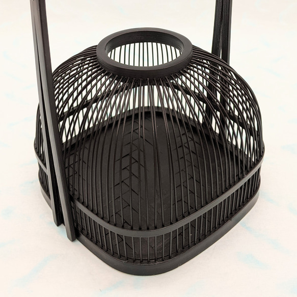 An elegant black Suruga bamboo flower vase with a rattan-wrapped handle, showcasing intricate vertical bamboo lattice work. – view 9