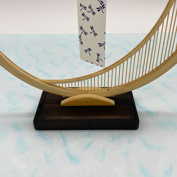 A delicate tabletop wind chime featuring a crescent moon-shaped Suruga bamboo frame holding a small dark Nambu cast iron bell – view 6