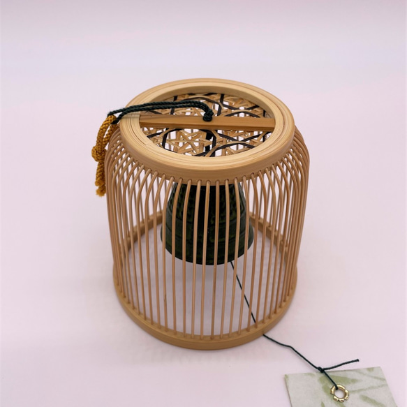 A delicately woven Suruga bamboo wind chime dome inspired by a Komuso monk's basket hat, containing a black Nambu iron bell. – view 6
