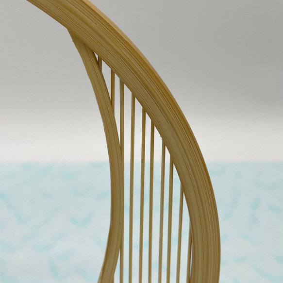 A delicate tabletop wind chime featuring a crescent moon-shaped Suruga bamboo frame holding a small dark Nambu cast iron bell – view 7