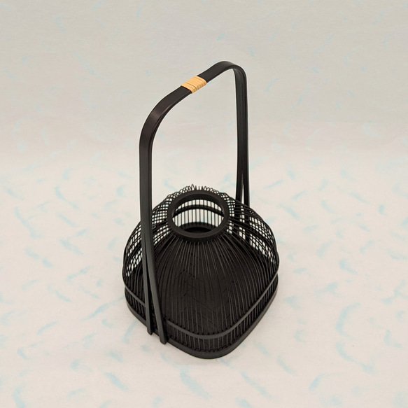 An elegant black Suruga bamboo flower vase with a rattan-wrapped handle, showcasing intricate vertical bamboo lattice work. – view 7