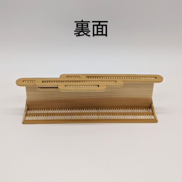 Compact modern wall-mounted Kamidana made of delicate vertical bamboo sticks and a cedar base, featuring a carved bamboo cloud motif. – view 9