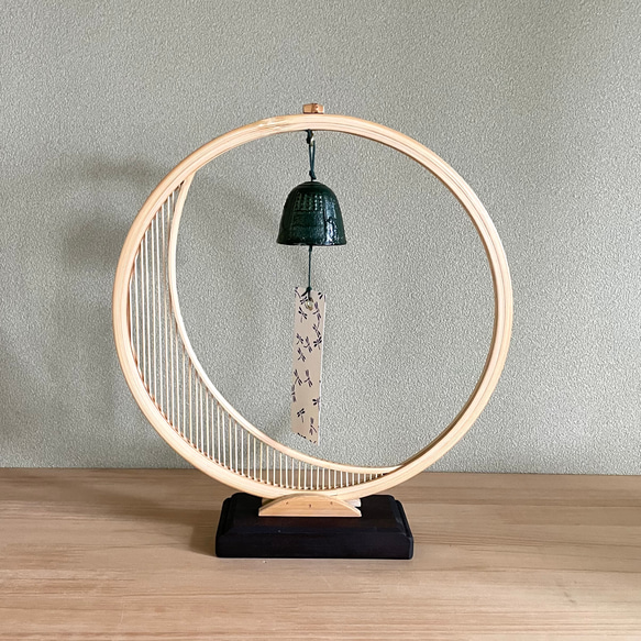 A delicate tabletop wind chime featuring a crescent moon-shaped Suruga bamboo frame holding a small dark Nambu cast iron bell – view 8