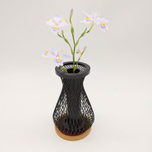 An elegant black bamboo weave single-flower vase standing on a square bamboo base with a red leather top insert.