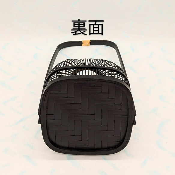 An elegant black Suruga bamboo flower vase with a rattan-wrapped handle, showcasing intricate vertical bamboo lattice work. – view 8