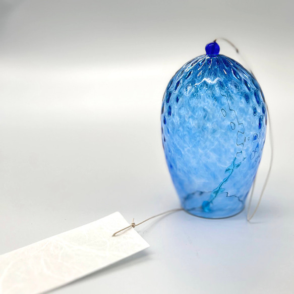 A handblown blue recycled glass furin wind chime with a white Ozu Washi paper wind catcher hanging from a wax cord. – view 2