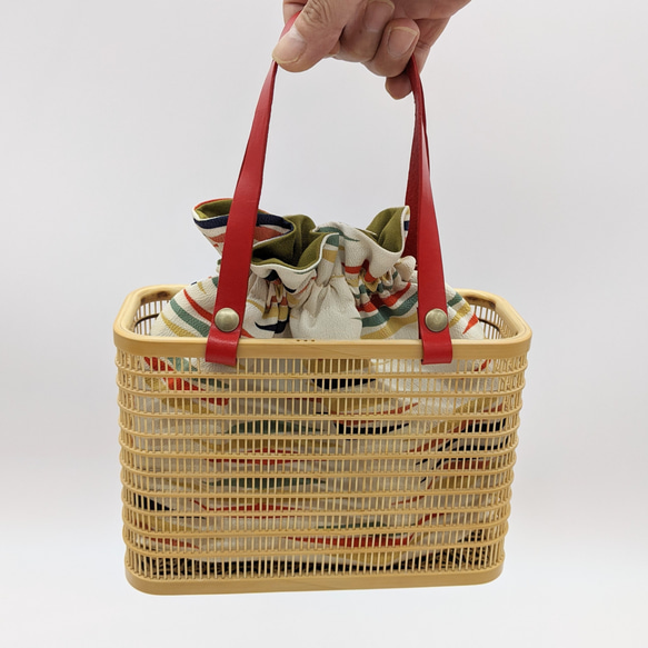 A rectangular hand-woven Suruga bamboo basket bag with a red leather handle and a vintage white silk drawstring inner pouch featuring a mist pattern – view 2